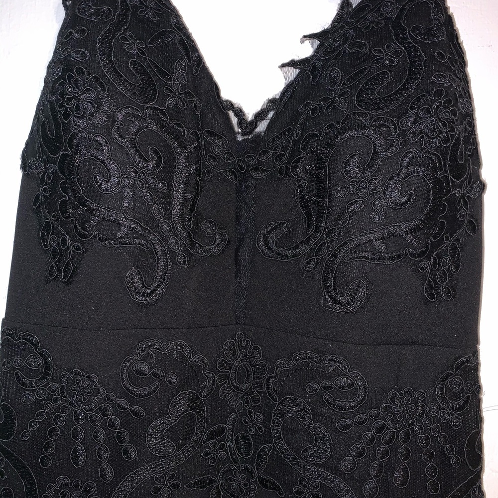 Long black dress with lace appearance and slit